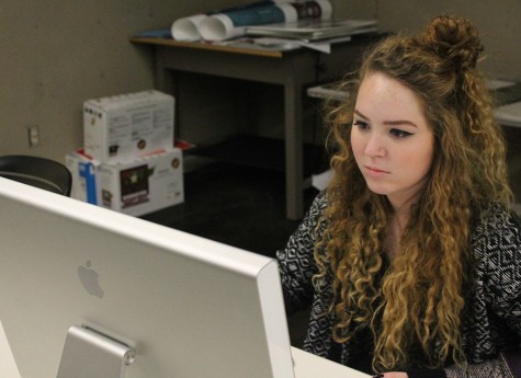 Zoe Volk,a junior graphic design major, working on projects in the Doudna computer lab.