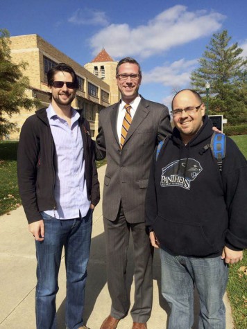 Former College Democrat members Ryan Woods and Mike Olsen stand with Illinois State Treasurer Michael Frerichs, center, outside of the Martin Luther King Jr. University Union.
