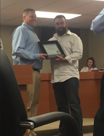 Charleston Mayor Brandon Combs gives Brendan Lynch the first Mayor Citizenship Award at the city council meeting Tuesday in Charleston City Hall.