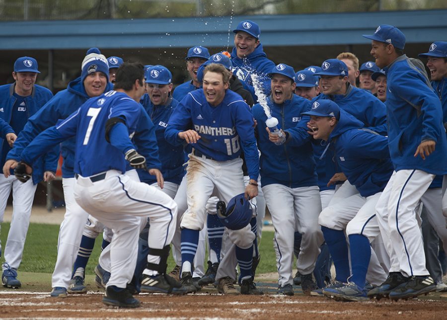 The baseball team celebrates with Hunter Beetley (7) after his walk-off two-run home run in the bottom of the 11th inning during the Panthers first game of a three-game series against Eastern Kentucky Saturday at Coaches Stadium. The Panthers won the first game 13-11.