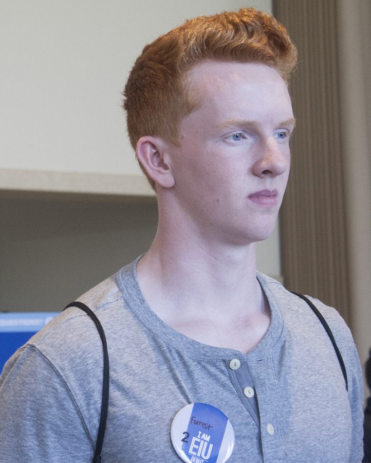 Forrest Baumgarten, an incoming student for the fall semester from Plymouth Indiana, who plans to major in chemistry, talks to faculty Thursday afternoon at a summer orientation program in the Martin Luther King Jr. University Union University Ballroom. “I chose Eastern because of swimming,” Baumgarten said.