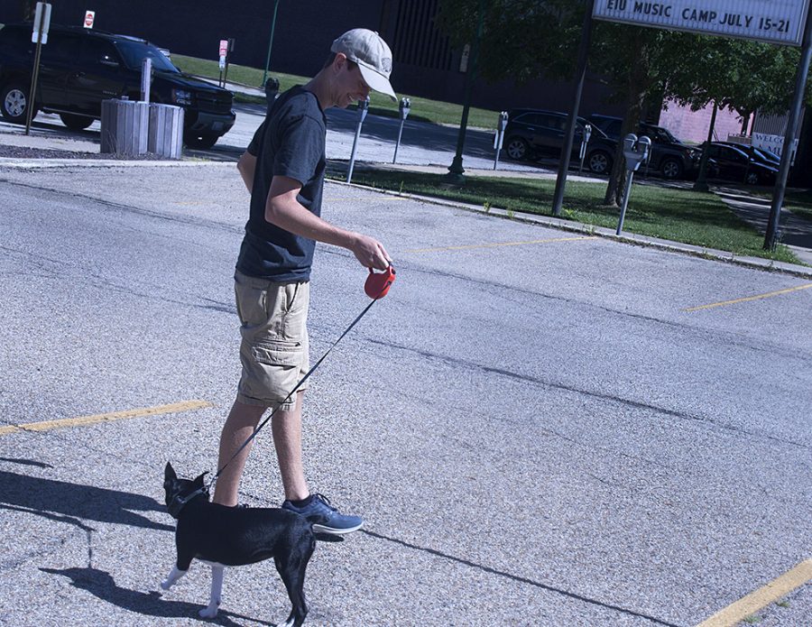 Sam White walks with his dog by the Martin Luther King Jr. University Union.
