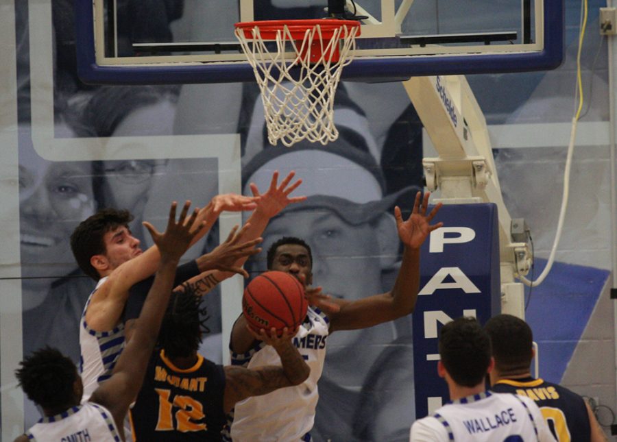 Rade Kukobat and Aboubacar Diallo try to block Ja Morant’s shot attempt during Eastern’s 83-61 loss to Murray State in Lantz Arena Jan. 17.