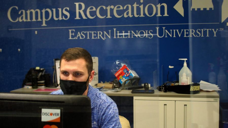 Trey Grubert, a second-year sports administration grad student, works the front desk at the Student Recreation Center. The front desk monitors student employees and enforces safety guidelines although, Grubert says, Things have been slow [at the desk] since we cant check out equipment.