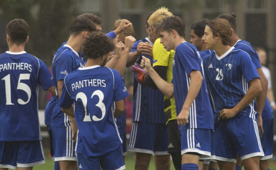 The Eastern mens soccer team huddles before taking the field for the second half against Green Bay Tuesday at Lakeside Field. The Panthers and Phoenix played to a 1-1 tie. 