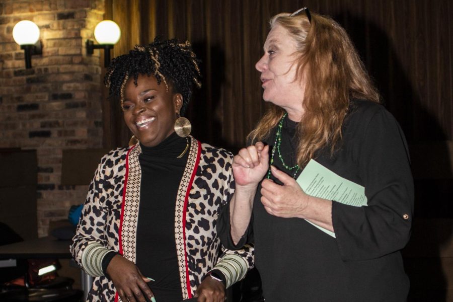 Ky Newson (left) and Angie Hunt (right) laugh as Hunt gives a speech about Newson before presenting her with the 2020 Women of Achievement Awards Wednesday evening at 7th Street Underground.