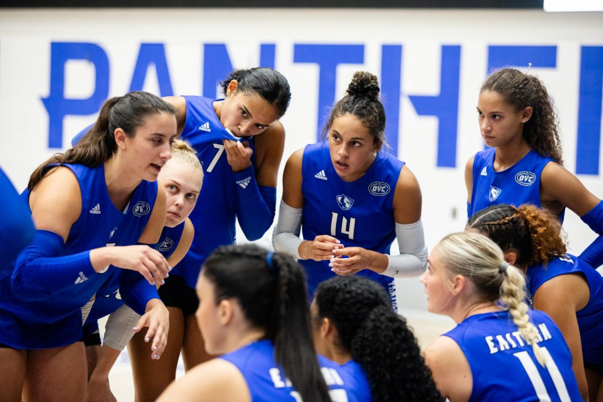 Senior Sylvia Hasz (23), talks with the rest of her team during a timeout at their game against Valparaiso.