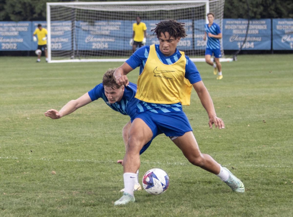 Freshman defender/midfielder Patrick Osilaja tries to keep the ball from a defender.