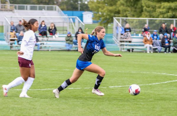 Kate Germano, a sophomore midfielder (11), dribbles the ball up field towards Little Rock Trojan territory at Lakeside Field Sunday afternoon.