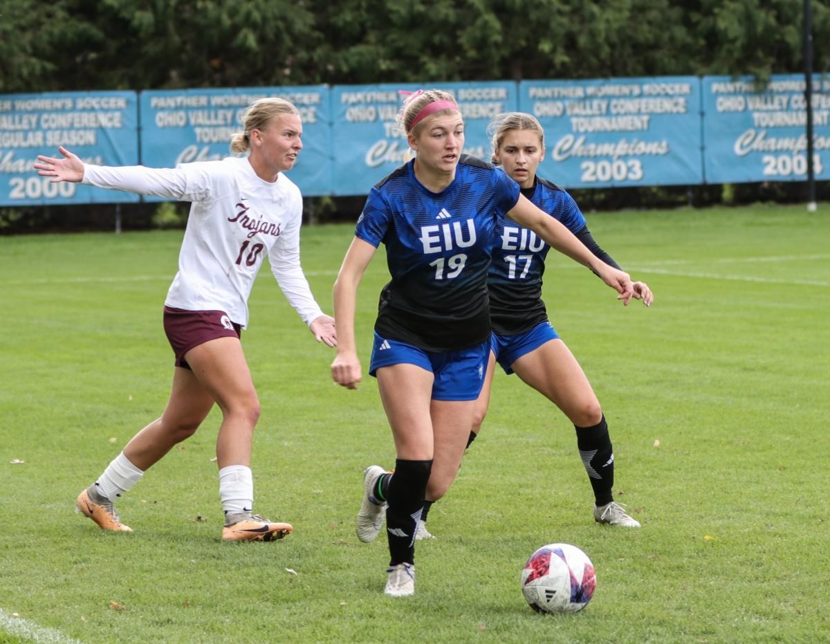 Avery Richardson, a junior midfielder (19), steals the ball from Little Rock Trojans striker at Lakeside Field Sunday afternoon.