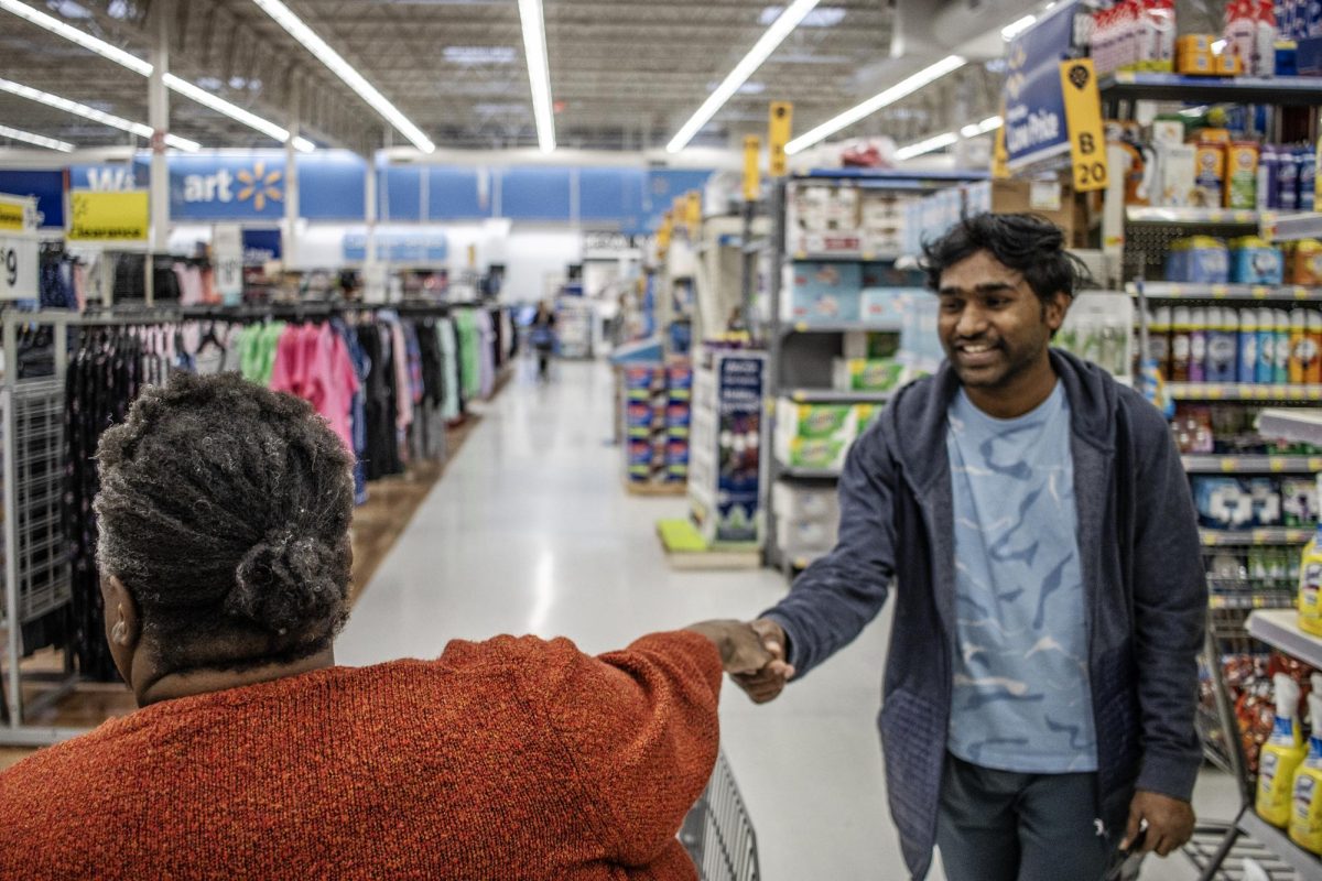 Marschelle McCoy runs into Krishna Darvath, a computer technology graduate student at Walmart Wednesday afternoon. They greet each other and talk a little about classes on  March 6.