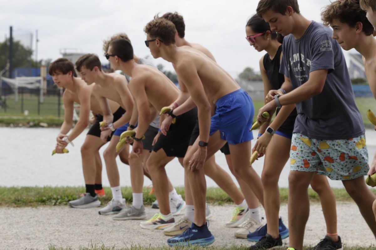 Athletes at Easterns Cross Country camp line up for a running start at their annual banana relay Friday, June 28.