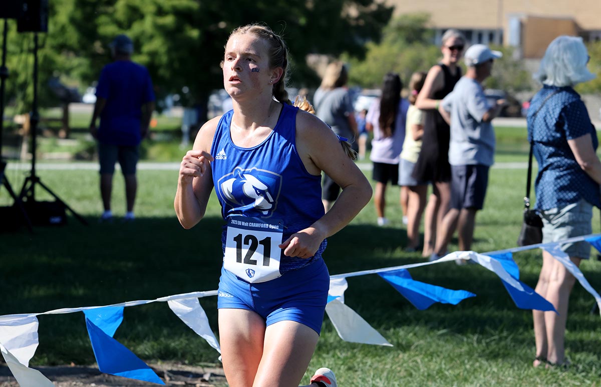 Mackenzie Aldridge, a senior kinesiology teacher licensure option, runs toward the finish line and places first at the EIU Walt Crawford Open at the Panther Trail.