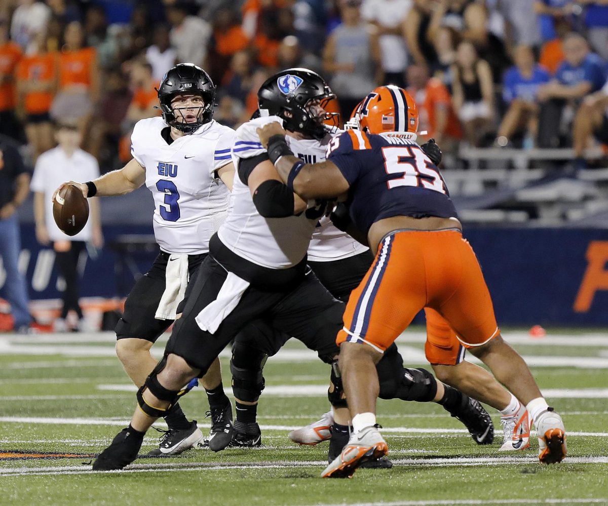 EIU graduate quarterback Pierce Holley looks for a pass during the team's season opener against the University of Illinois at Champaign-Urbana at Memorial Stadium Thursday night. The Panthers were shut out 45-0 to the Fighting Illini.  