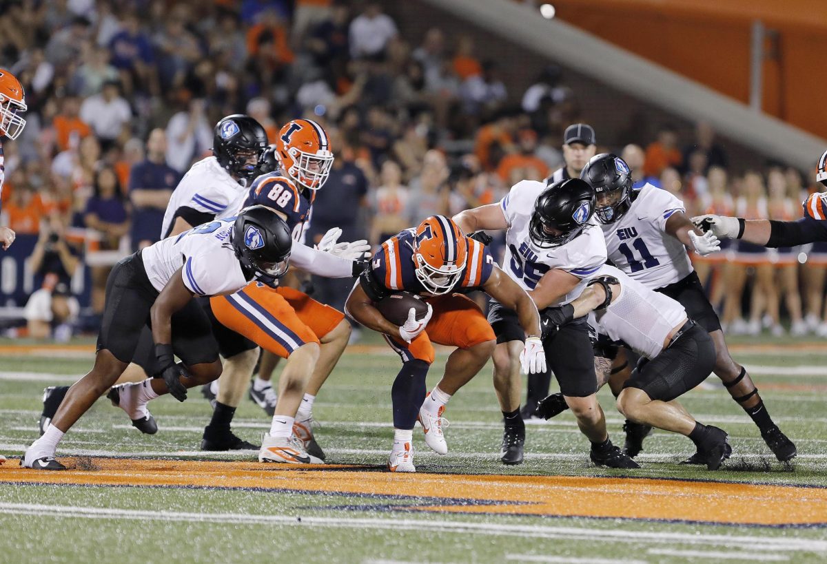 Illinois junior outside linebacker Alec Bryant attempts to slip past the EIU defensive line during the team's season opener against the Fighting Illini at Memorial Stadium Thursday night.