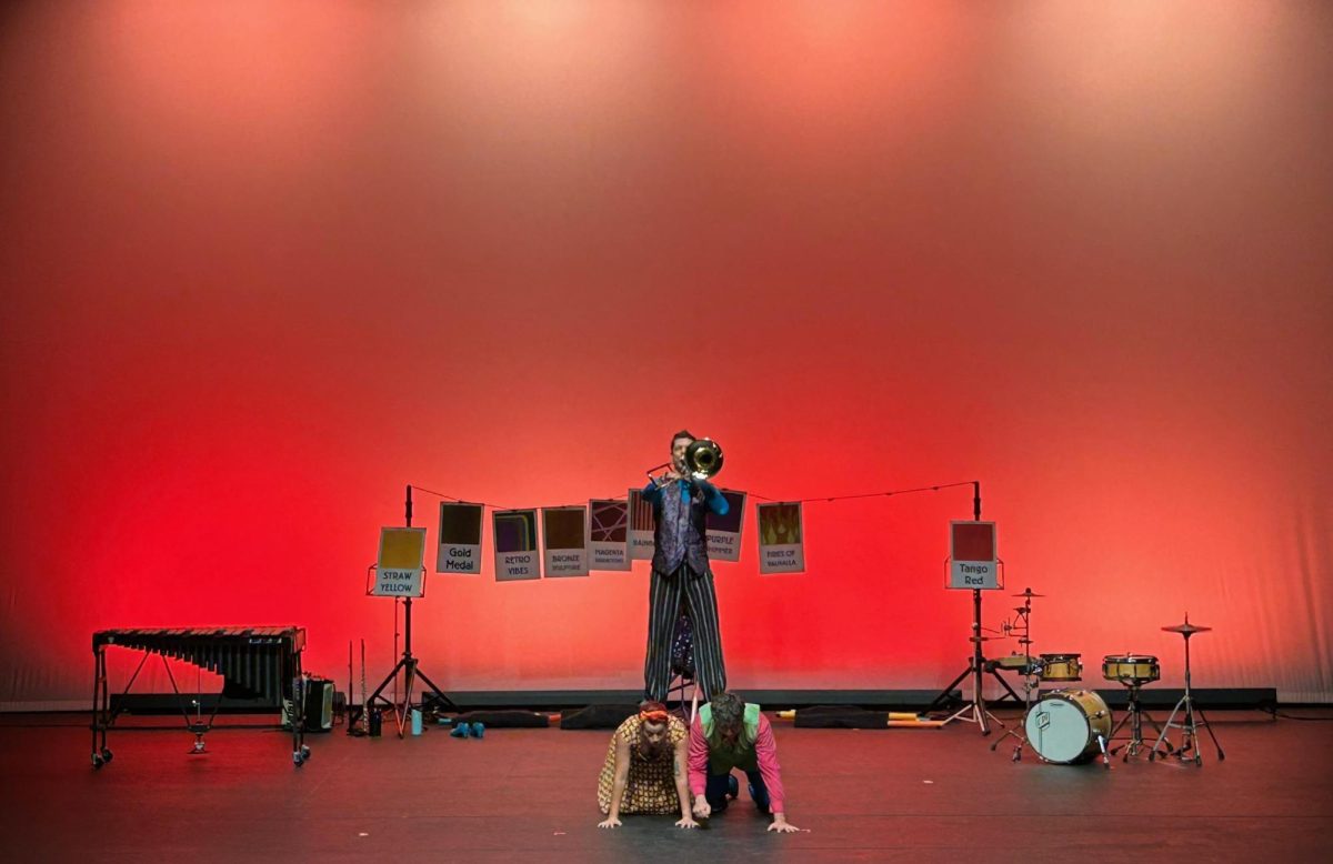 The Fourth Wall’s C. Neil Parson’s playing “Ride of the Valkyries” while standing atop Hilary Abigana and Greg Jukes “Fruit Flies Like a Banana” in The Theatre at Doudna Performing Arts Center