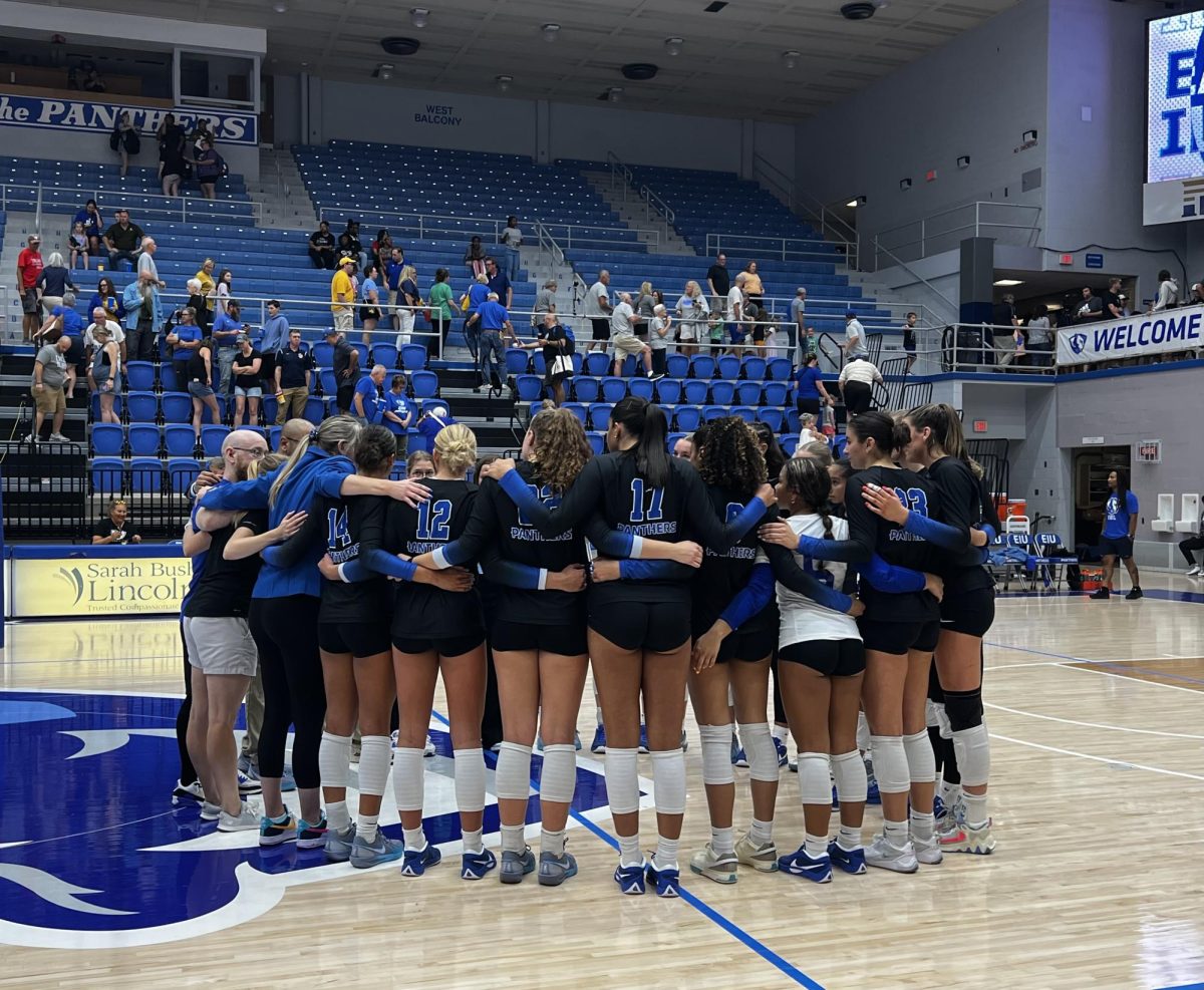 Eastern Illinois University’s volleyball team huddle in a circle after losing to the Marquette Golden Eagles 3-0 in Groniger Arena Friday evening on August 30, 2024.