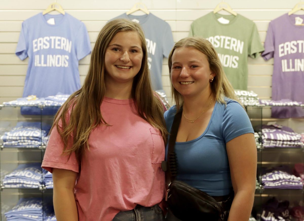 Sisters Emma Beurskens, a sophomore nursing major, and Alli Beurskens, a freshman early childhood education major, shop for Eastern Illinois University merch at the University Bookstore in the MLK Jr. University Union on Thursday Move In Day. Emma Beurskens said she looks forward to the year and seeing her sister start college.