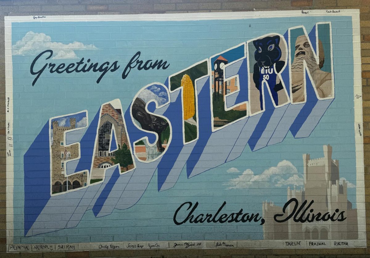 The postcard mural, located in the Triad facing Booth Library, was painted by Grace Otzwirk over summer break.