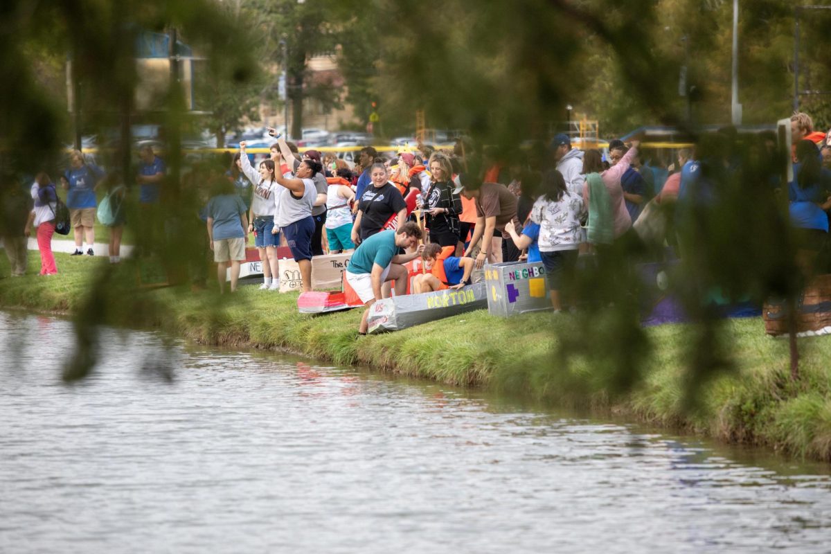 At Campus Pond there was students from each resident hall participating in the carboard boat race, each hall designed a cardboard boat with the theme "game-on" several groups lined up by the pond before pushing each boat in, on the Eastern Illinois University Campus Charleston Ill, On Sept. 26, 2024. 