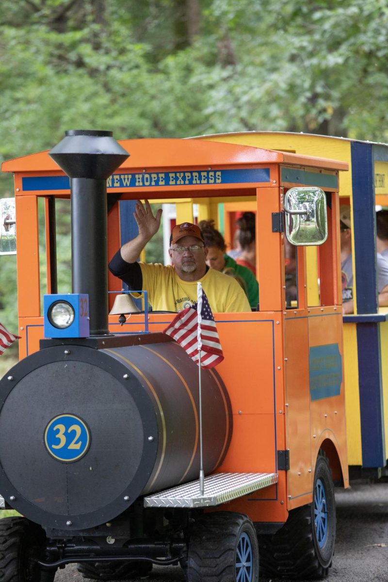 Train Conductor Lynn Farmer is a employee of Camp New Hope who said he loves to see the kids smile on the train ride around the camp grounds.