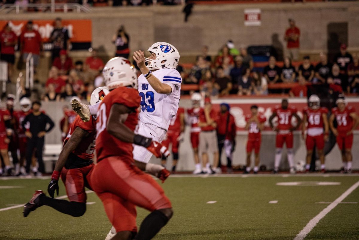 Sophomore Punter Jacob Horvath gets taken down while trying to catch the ball mid air, during the Eastern Illinois University vs Illinois State University in Normal Ill