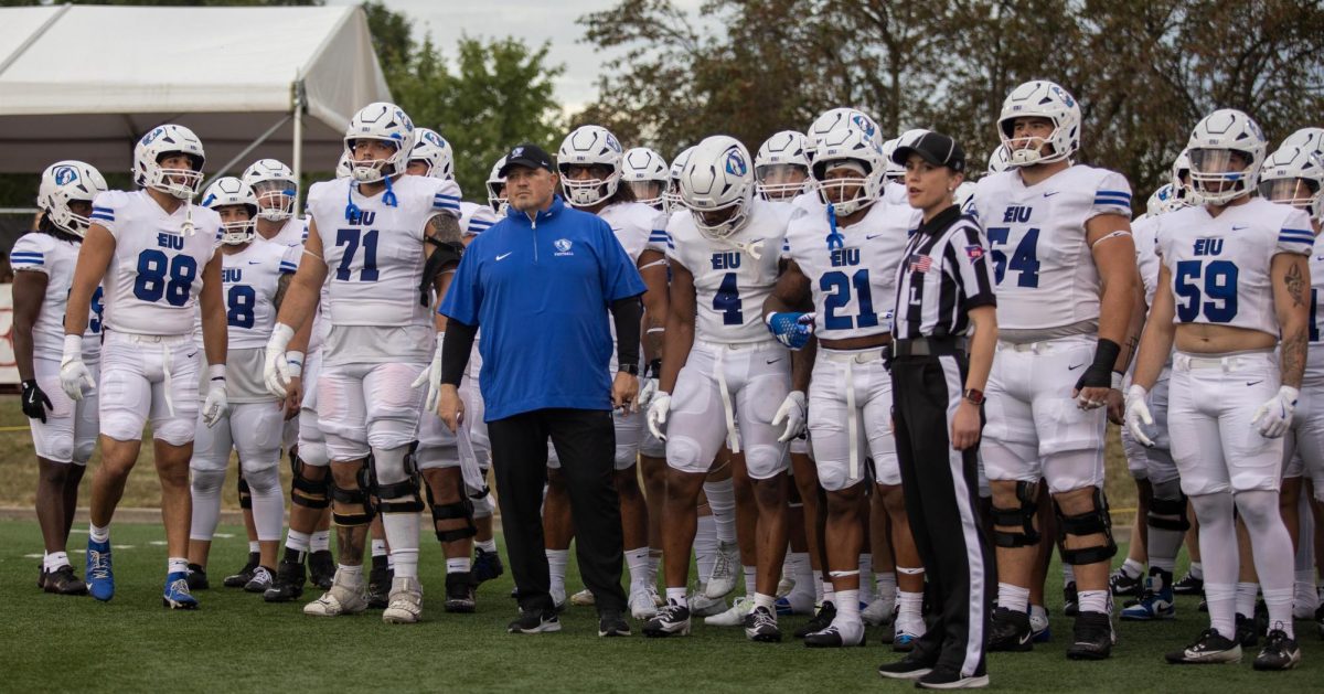 Head Football Coach, Chris Wilkerson waits with the football team to run on the hancock field before the Illinois State University, vs Eastern Illinois University