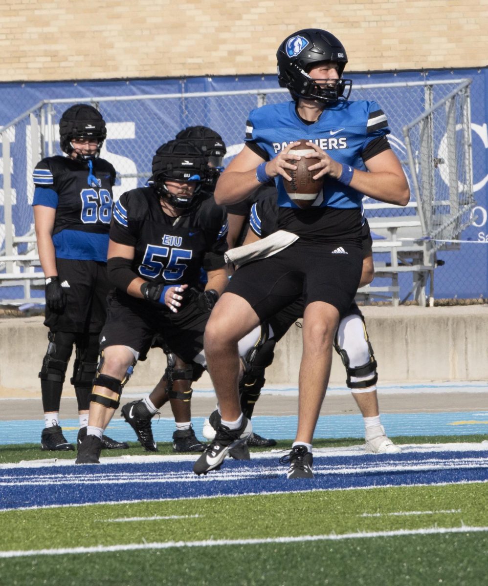 Junior quarterback Joey Sprinkle, practices his throw during the football practice Wednesday. 