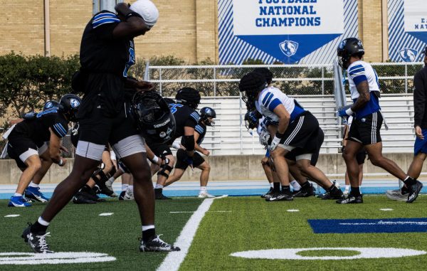 The football team is practices for their home opener on Saturday.