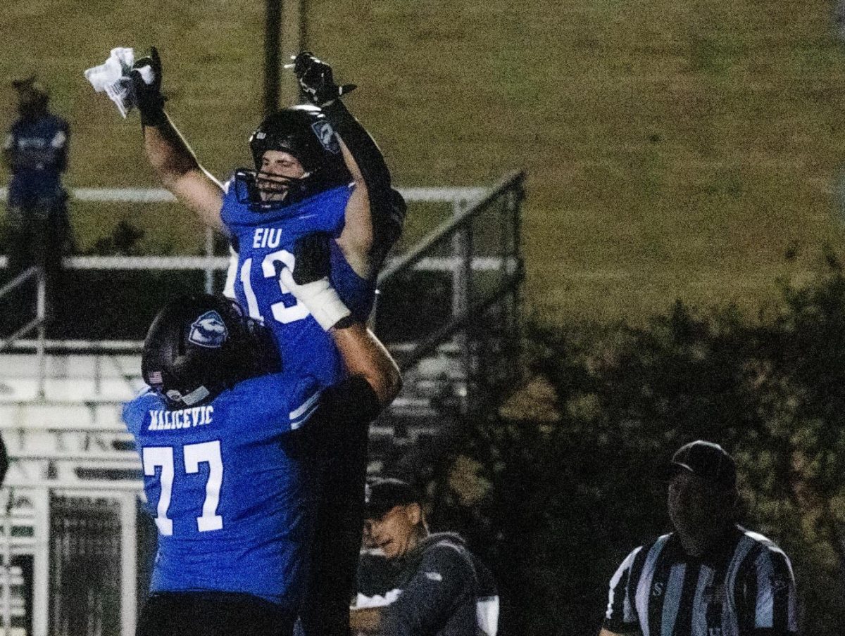 Offensive Line sophomore, (77) Sandro Malicevic picks up wide receiver senior Cooper Willman after a touch down in the end zone, at the Eastern Illinois Panthers vs Indiana State Sycamore, at O'Brien Field. Saturday night. Panthers won 27-20.