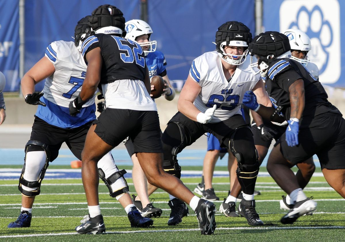 Redshirt junior Noah Howard (63) blocks defensive players during football practice at O'Brien Field Wednesday afternoon.