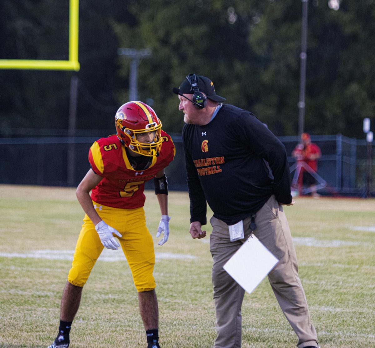 sophomore wide receiver/defensive back Braxton Hanner talking to head coach Brian Halsey in the first half at Trojan Hill Charleston 