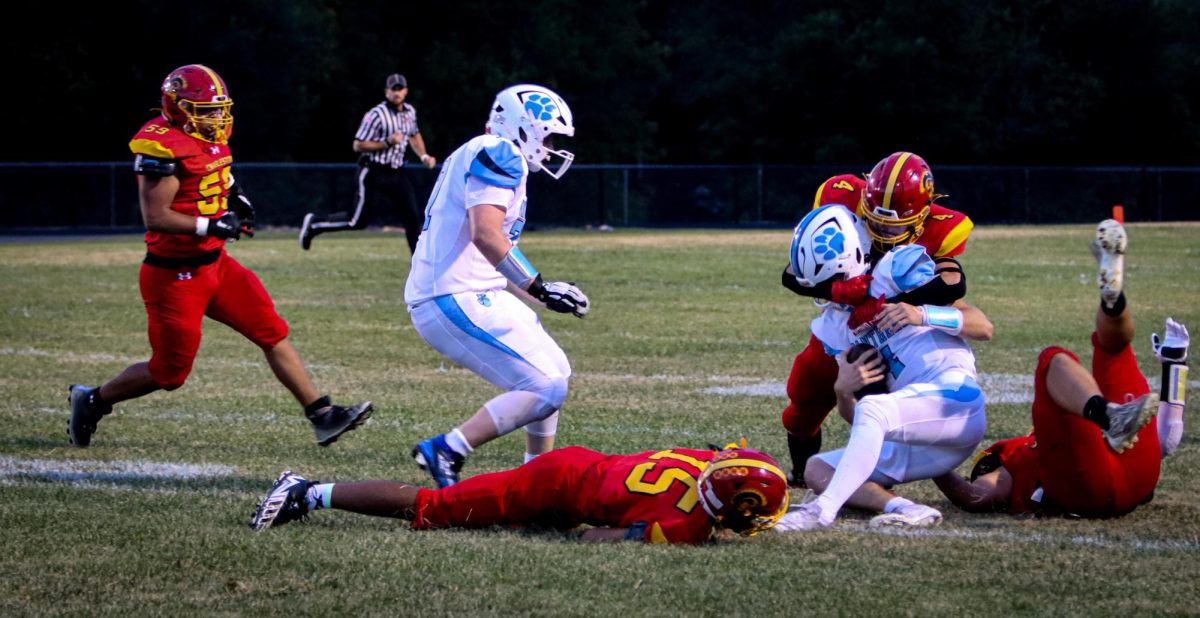 Charleston junior defensive back Alex Matheny takes down Jersey senior quarterback Jaxon Brunaugh during the first quarter of Charleston’s 45-34 win against Jersey on Sept13 2024, in Charleston Illinois. 