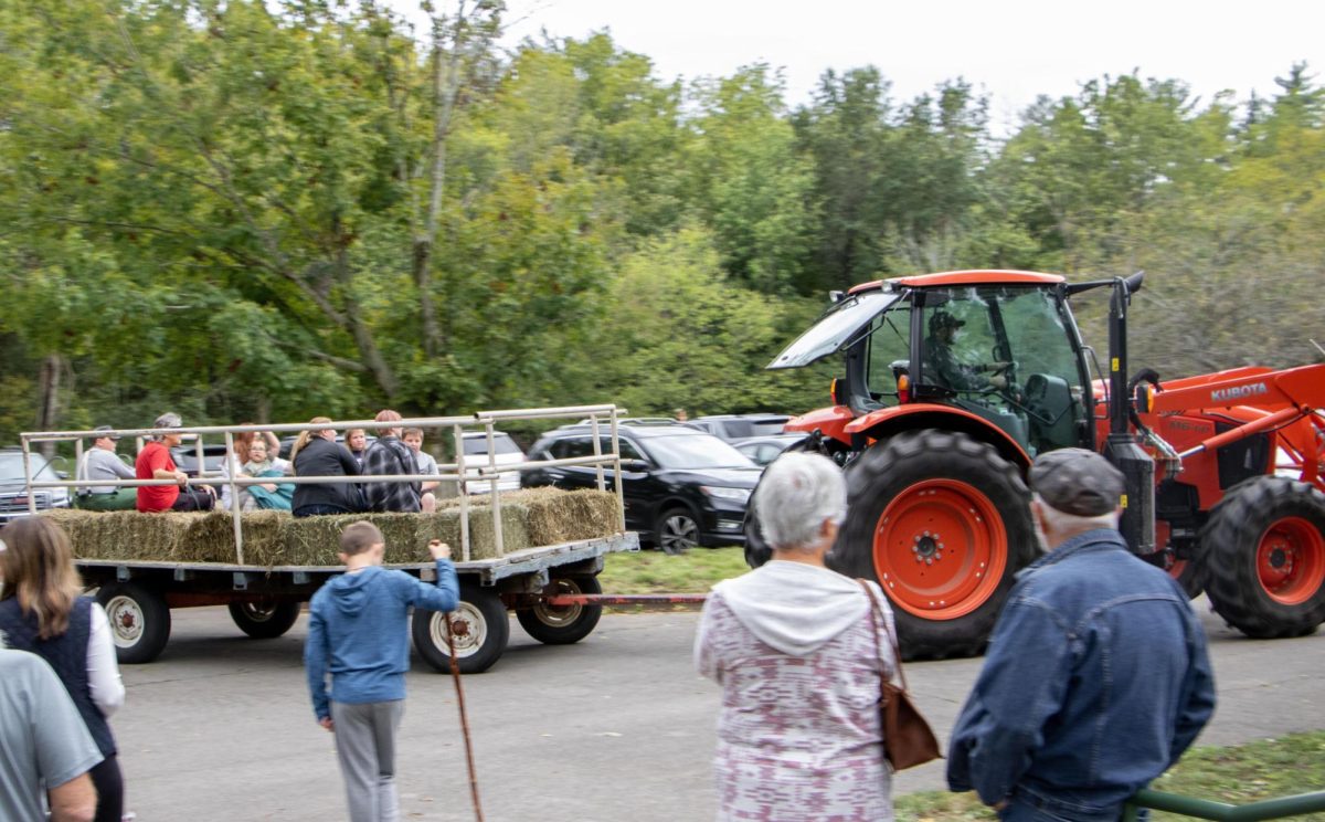 New visitors are driven into Harvest Frolic via hayride. ccording to Board President of Lincoln Log Cabin Foundation Lori Henderson, over 5,000 people are expected to visit the cabin during Harvest Frolic.