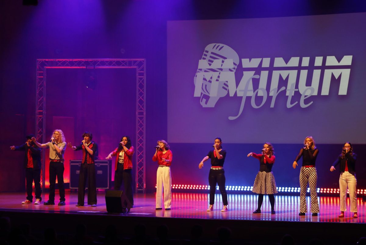 Members of Charleston High School's Maximum Forte A cappella group take stage at the Doudna Fine Arts Center Saturday evening.