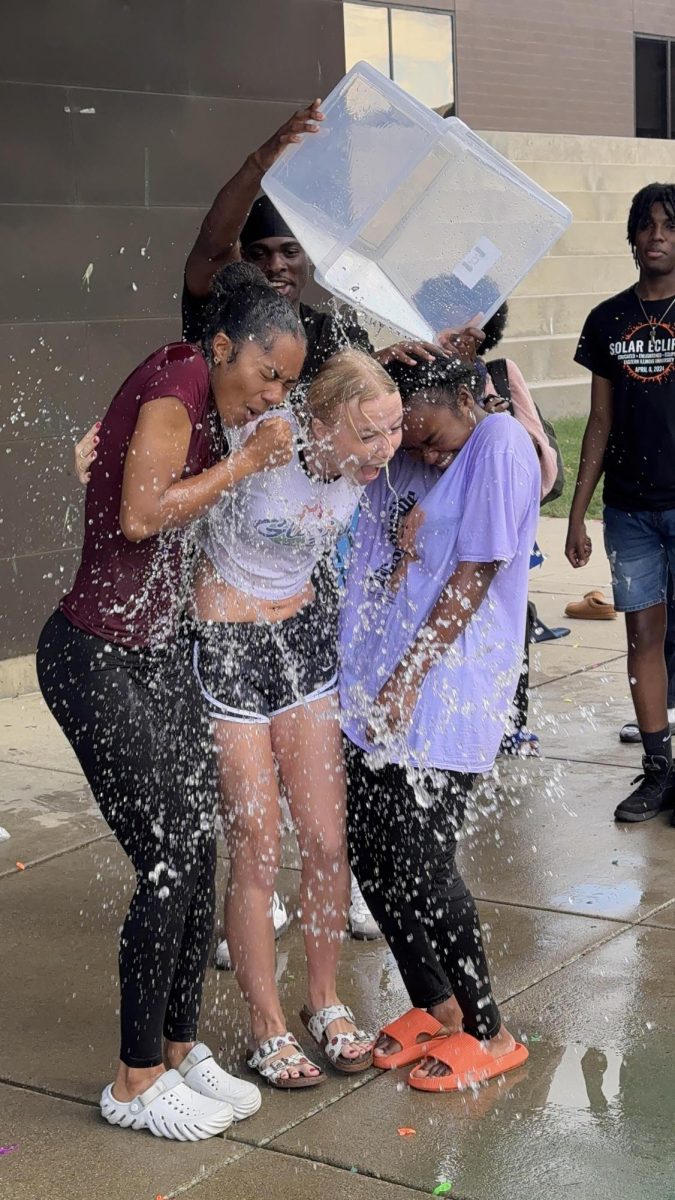 The Kat Walk members get splashed by former president, Michael Mboyo at the Splash-A-Kat event fundraiser on Sept. 26, 2024 at the Doudna Fine Arts Center overhang