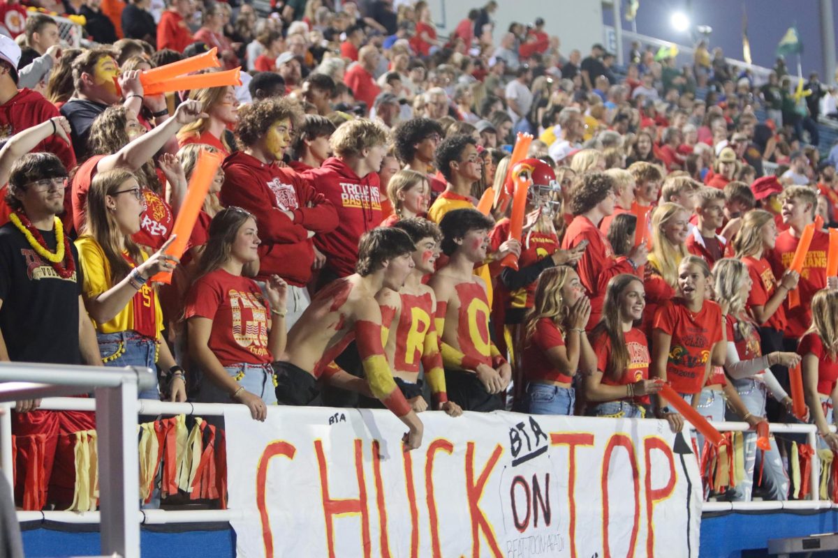 Charleston High Trojan fans getting ready with body paint and posters for the Coles County Clash against Mattoon at O’Brien Field on October 4. Charleston lost 20-10.