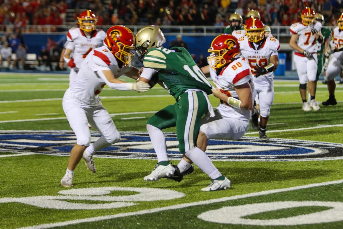 Charleston high senior defensive back Jayden Sikorski and senior defensive end Mason Redfern drag down Mattoon junior quarterback Shayden Neff during the second half of the Coles County Clash against Mattoon at O’Brien field on October 4th. Charleston lost 20-17.
