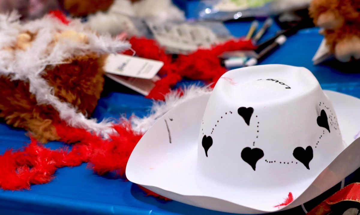 Students gather for during the homecoming week event Western Craft Night in the University Ballroom in the Marin Luther King Jr Union, too decorate hats, enjoy music and to stuff a stuffed cow, on the Eastern Illinois University campus, Charleston Ill. Tuesday night Oct. 1,2024.