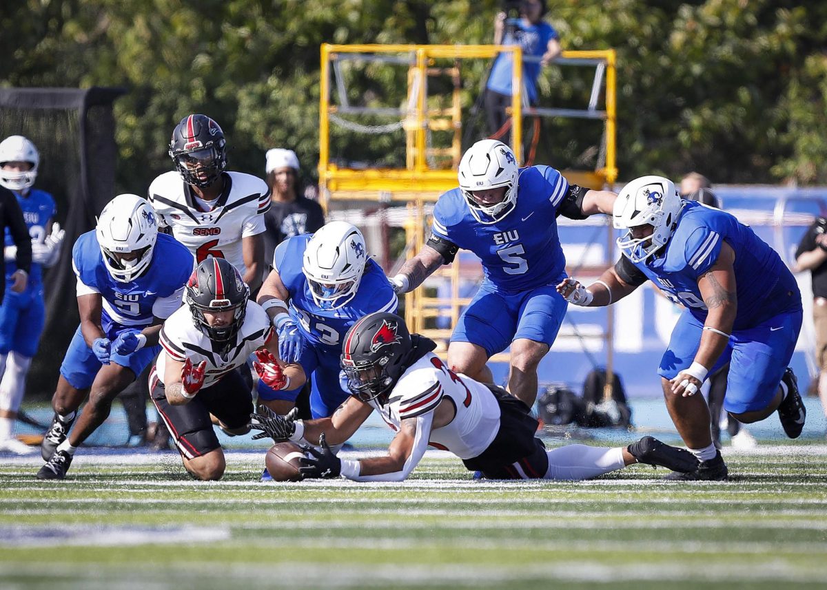 Players for both Eastern Illinois University and Southeast Missouri State University's teams scramble for a fumbled ball during EIU's homecoming at O'Brien Field against Southeast Missouri State University Saturday afternoon. The Panthers lost 34-27 against the Redhawks.