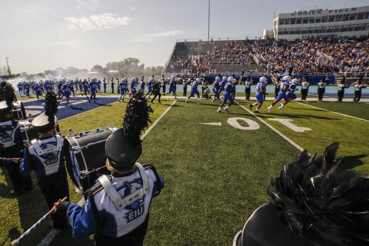 Eastern's football run out onto the field before the start of the homecoming game against the Southeast Missouri State University Redhawks on Saturday afternoon.