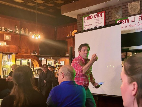 Larry Cox Jr. enthusiastically presents the difference between active listening and the art of listening at the first Final Fridays on October 25, 2024, at Friends & Co. in Charleston, Ill.