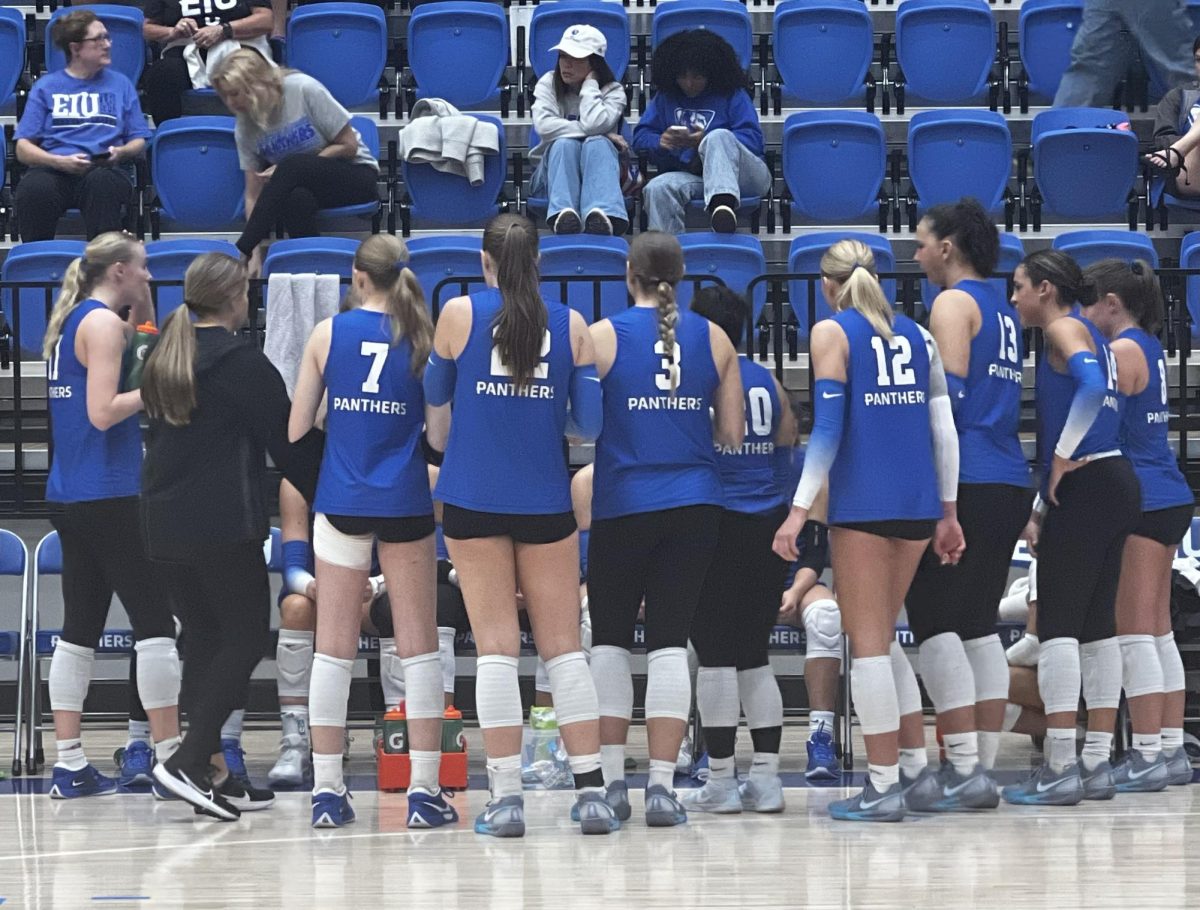 Eastern Illinois’ volleyball team huddles up before playing in the fifth set against Southern Indiana Thursday evening in Groniger Arena. The Panthers lost to the Screaming Eagles 3-2.