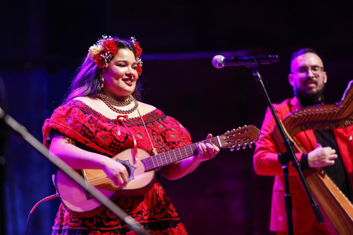 Grupo Bella vocalist Vanessa Ramirez sings during Grupo Bella's performance in the Dvorak Concert Hall in the Doudna Fine Arts Center Saturday evening. 