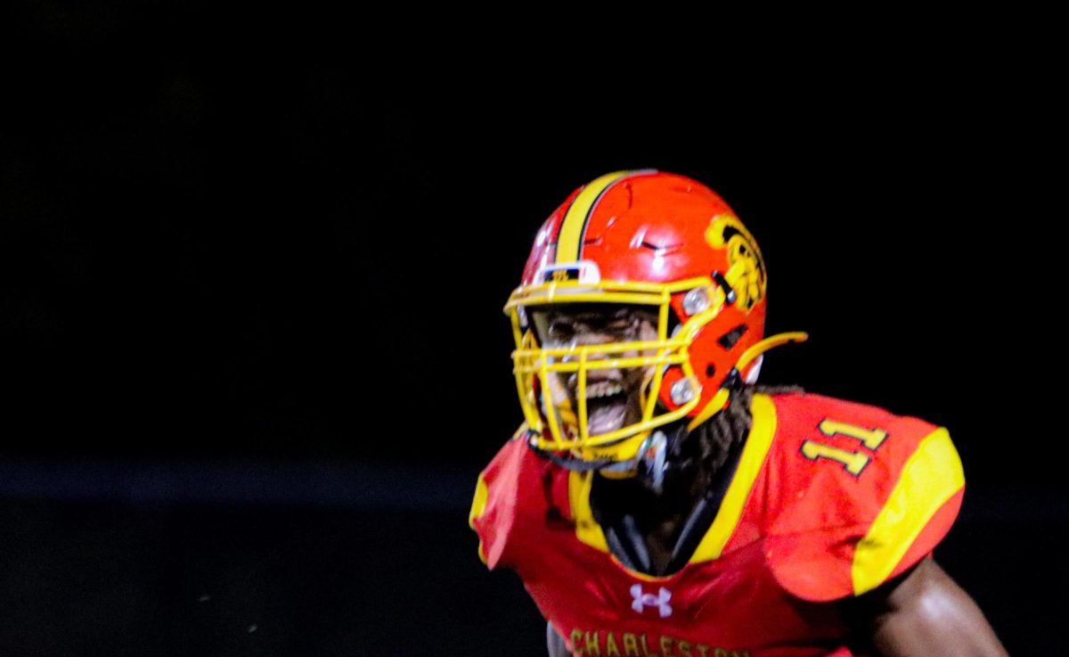 Charleston sophomore running back Treylin Couch bobble the ball before securing it and running for his fourth touchdown during the third quarter of Charleston’s 45-34 win against Jersey on Sept 13, 2024, in Charleston Illinois. 