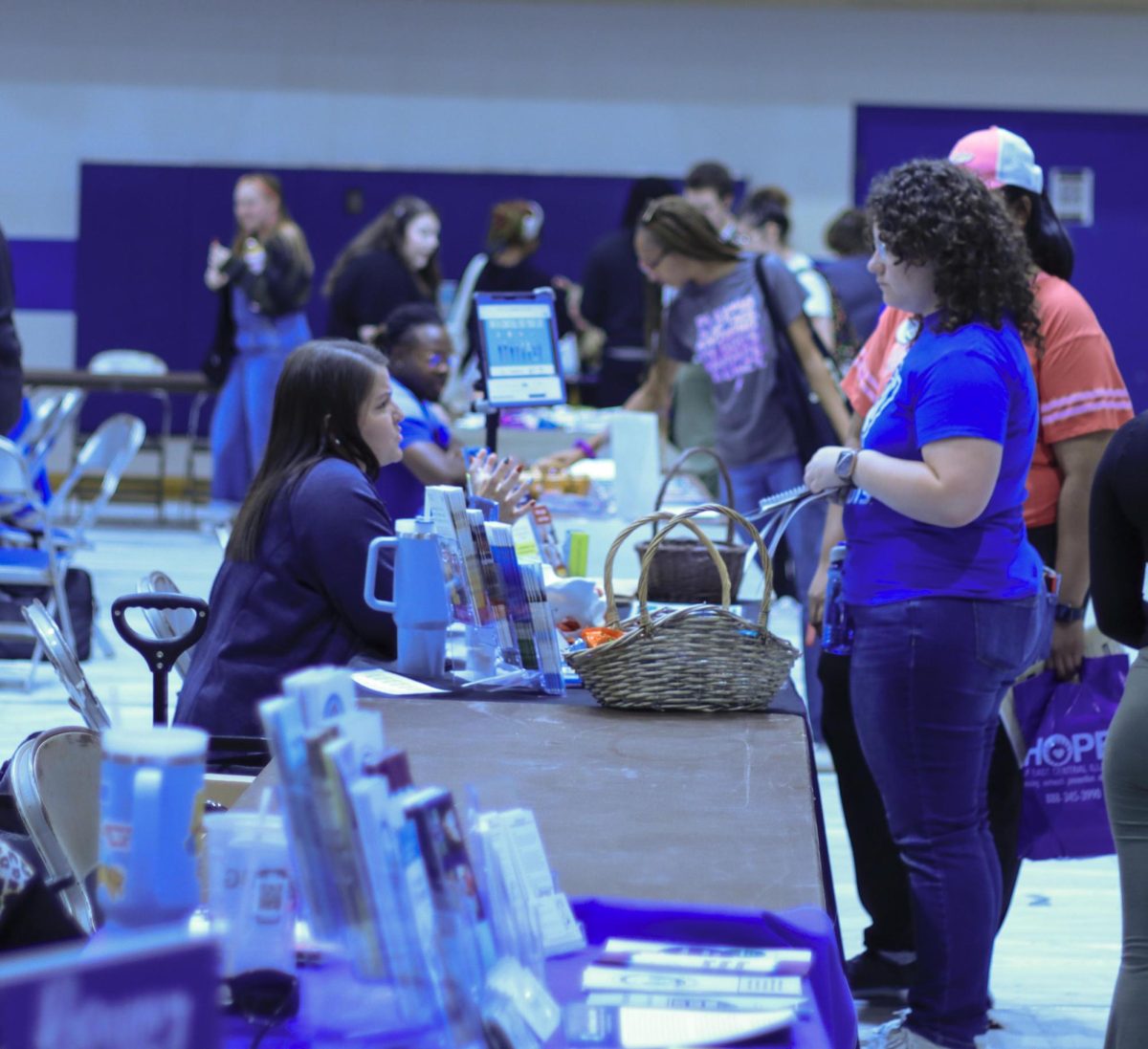 Student walk around asking question they have at the wellness and health fair 