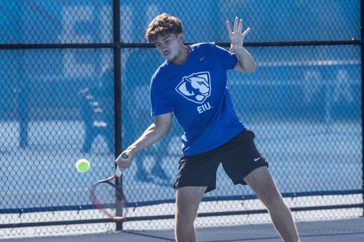 Freshman Durante Trocado smashes the ball during the Eastern Illinois Fall Invitational Friday at the Darling Courts. 