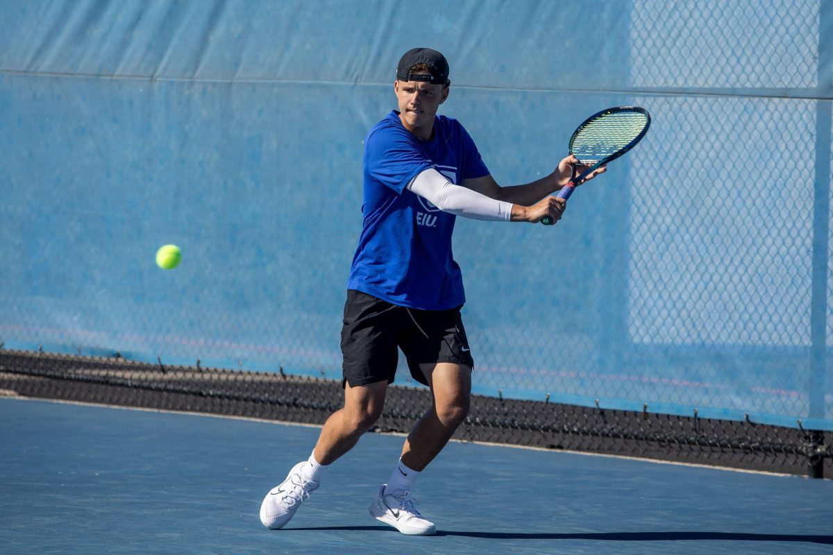 Freshman Ludolph Wiggett backhands the ball during the Eastern Illinois Fall Invitational Friday at the Darling Courts.