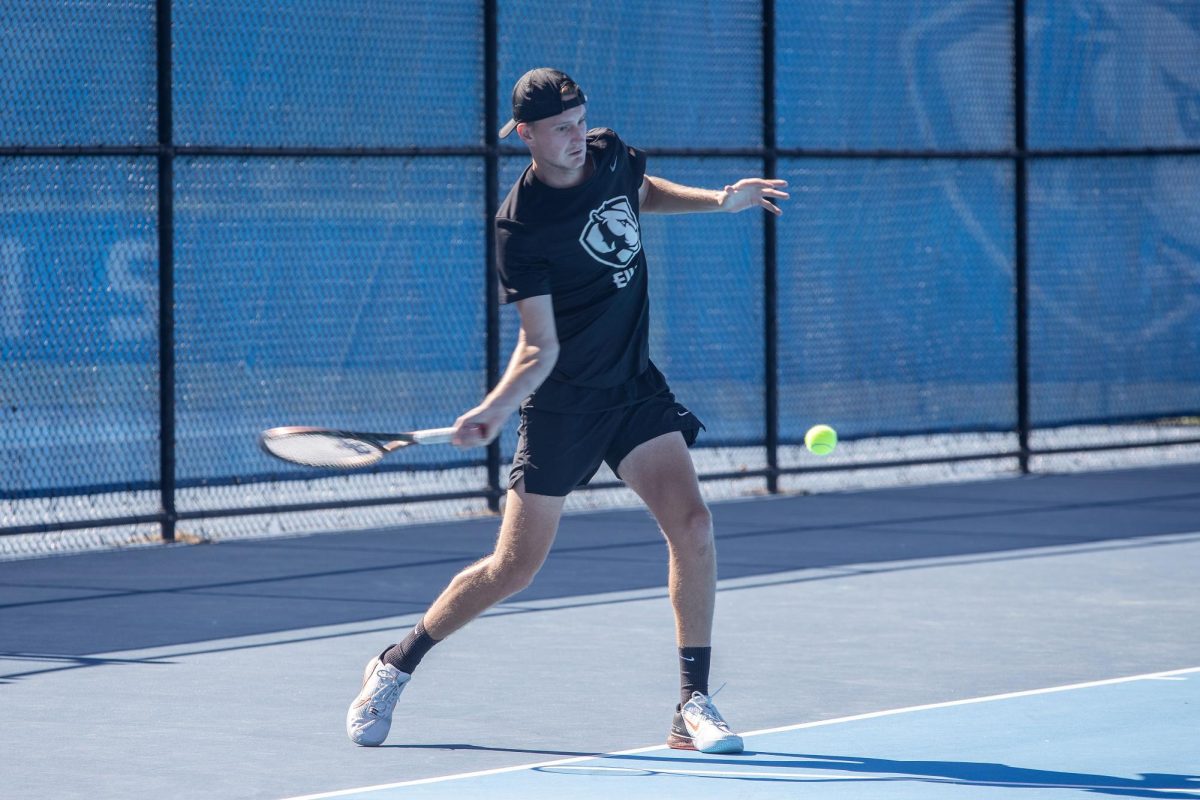 Senior Pieke Bouman forehands the ball over the net during the Eastern Illinois Fall Invitational Friday at the Darling Courts.