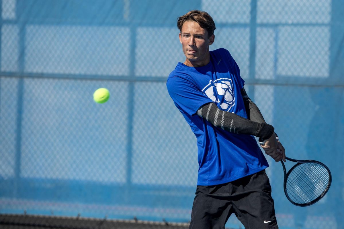 Freshman Fabien Planchard backhands the ball during the Eastern Illinois Fall Invitational Friday at the Darling Courts.